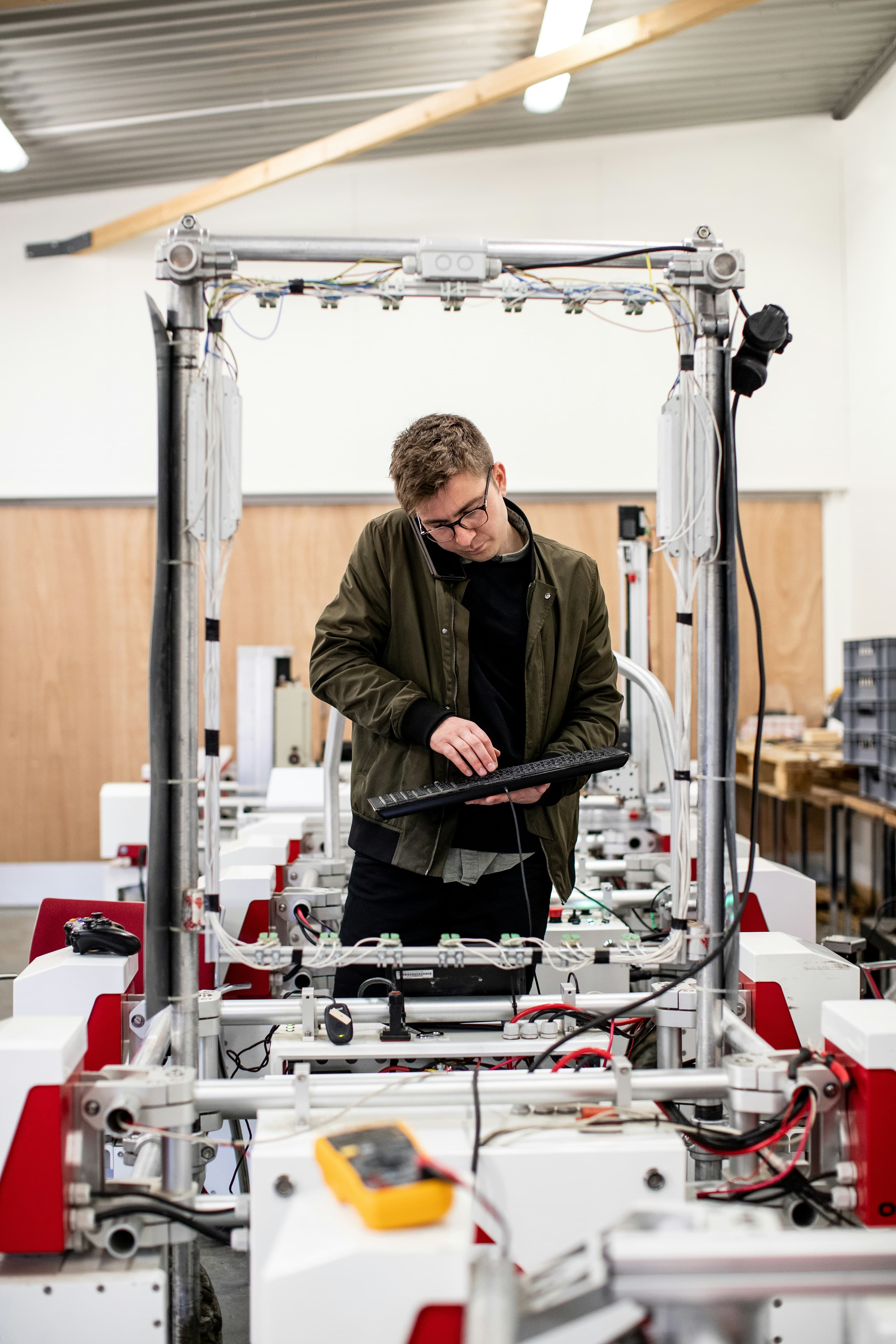 Automation engineer commissioning a production cell from a control terminal